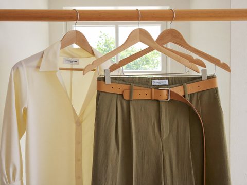 One complete outfit hung together on three wooden hangers